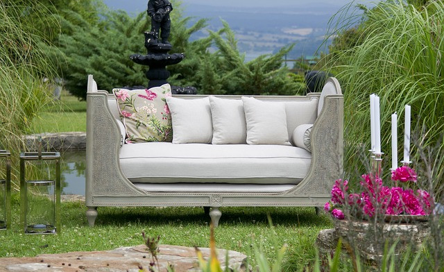 Garden furniture surrounded with garden accessories 