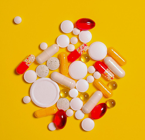 Picture of weight-loss supplements on a yellow background
