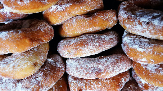 A picture of lots of sugary doughnuts