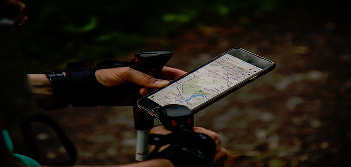 Hiker using his mobile GPS
